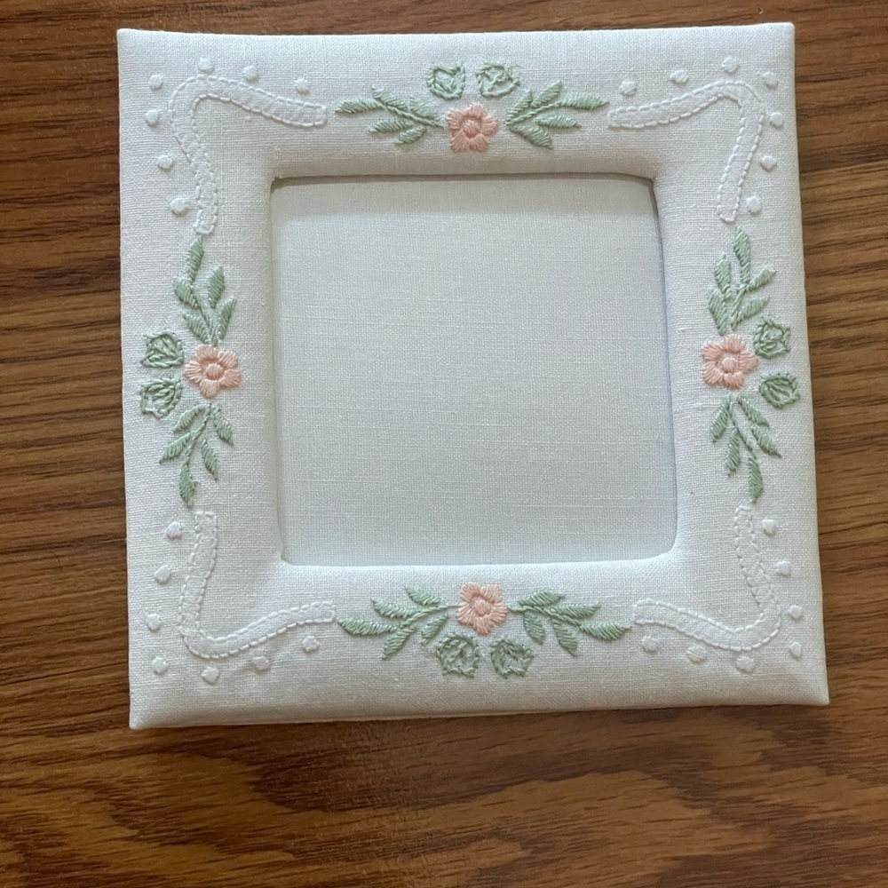 Vintage fabric photo frame with floral embroidery